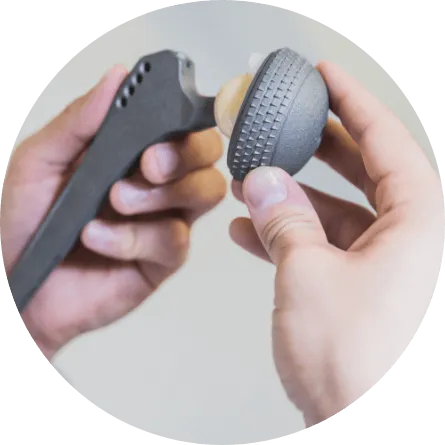 surgeon holding knee replacement device