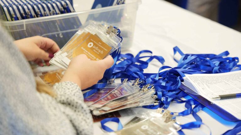 Personalized name badges await Summit attendees.