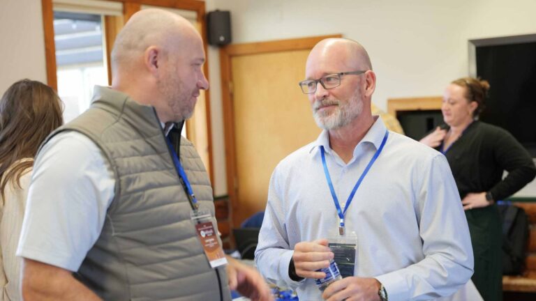 Candid moments of connection between Summit participants.