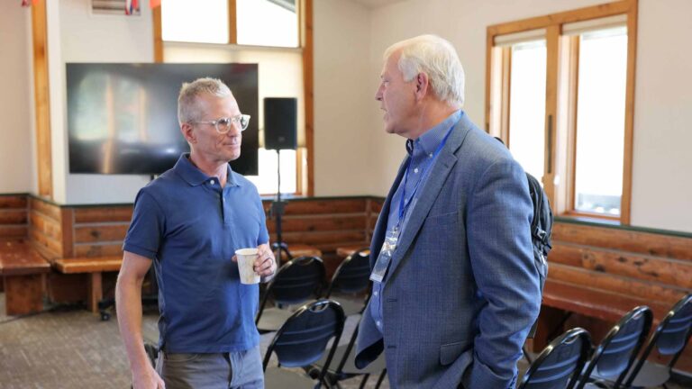 Eric Meyer and Kurt Loveless connect during a break between Summit sessions.